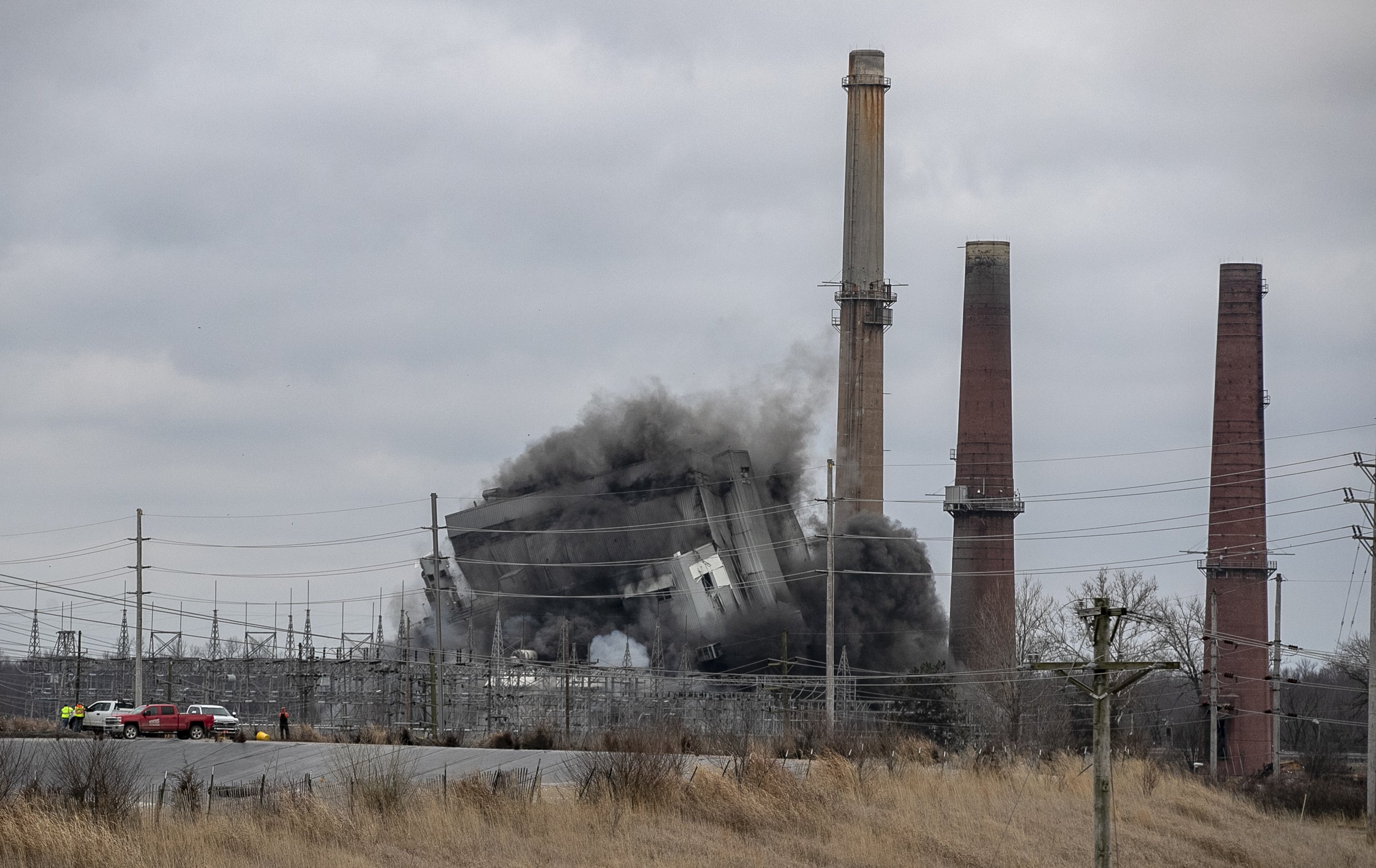 The Woodriver Power station in East Alton, Illinois falls down as it's demolished