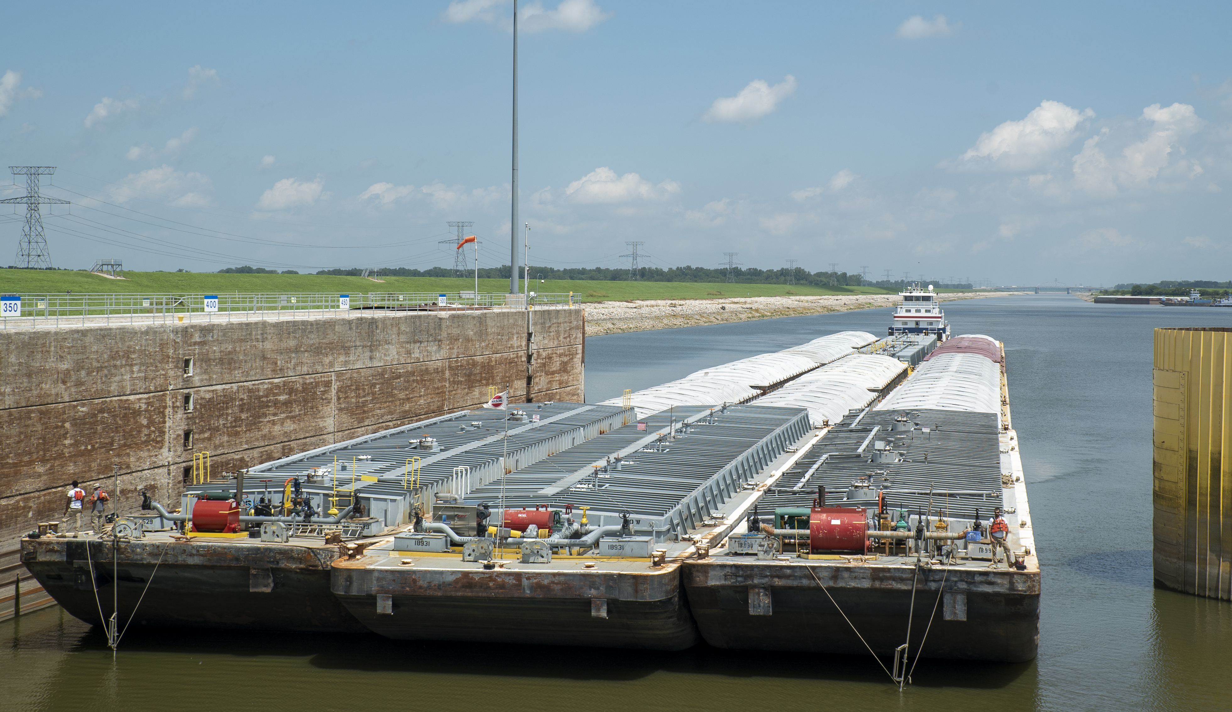 A barge approaches a lock.